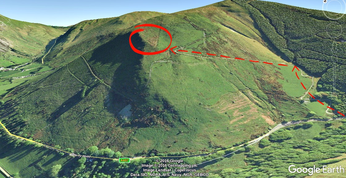 View from Corris Corner of a military jet banking hard through the Mach Loop turn point in the Welsh valley system